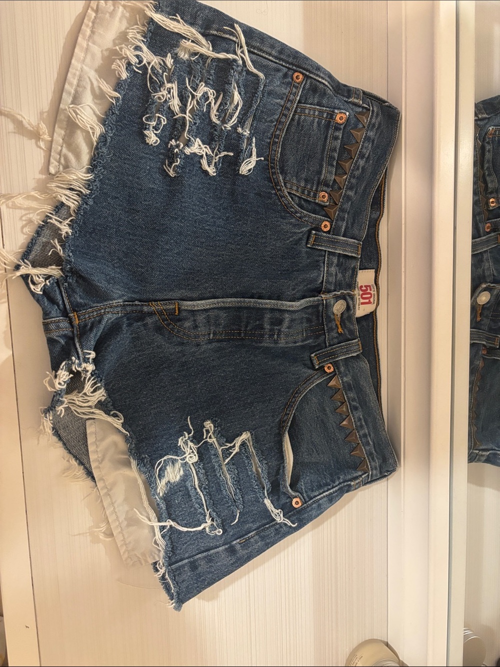 Levi's Distressed Dark Blue Denim Shorts with Stud Accents